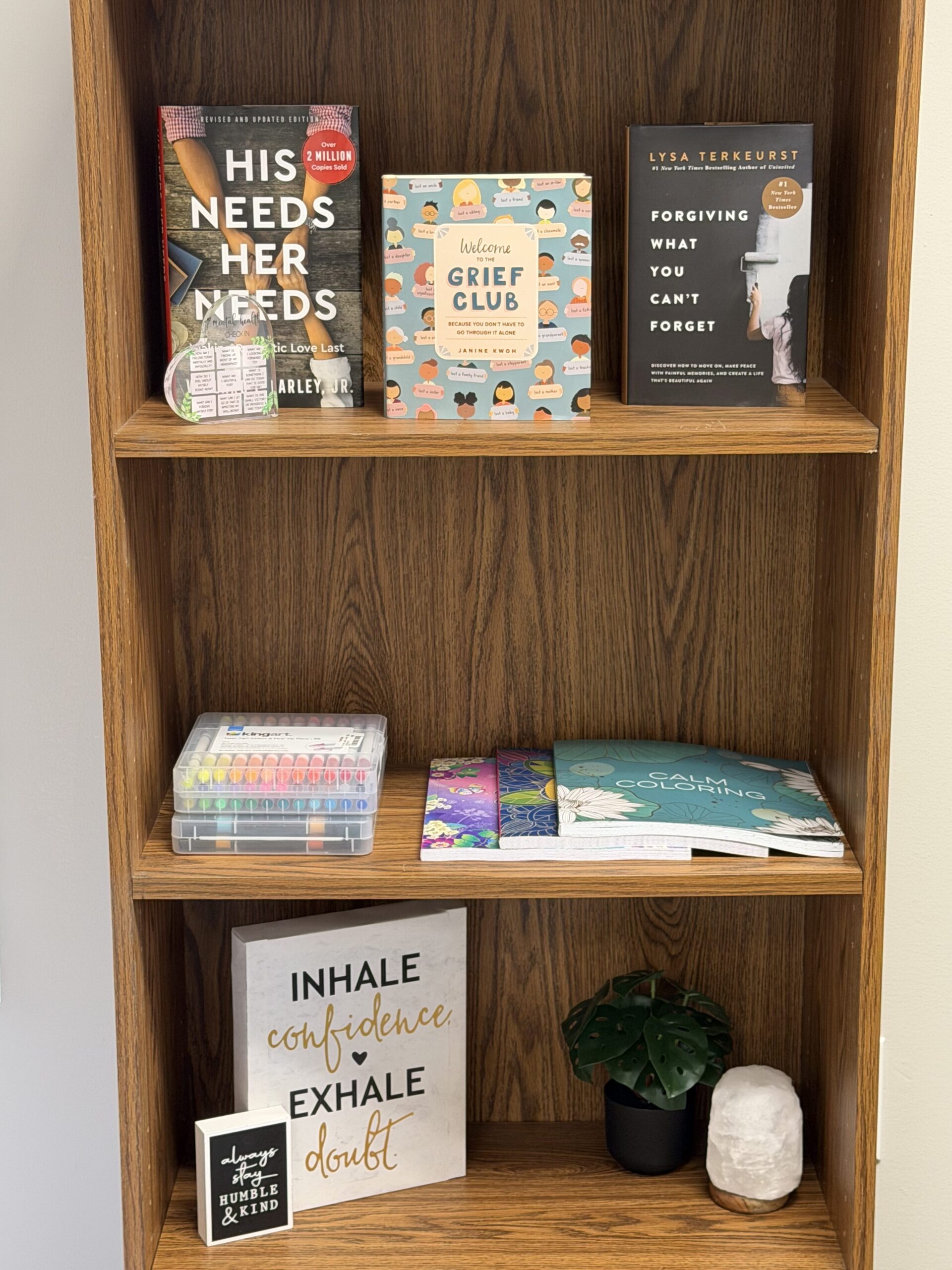 Bookshelf with inspiring books and sayings
